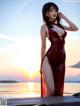 A woman in a red dress standing on a pier.