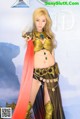 A woman dressed in a costume holding a sword.